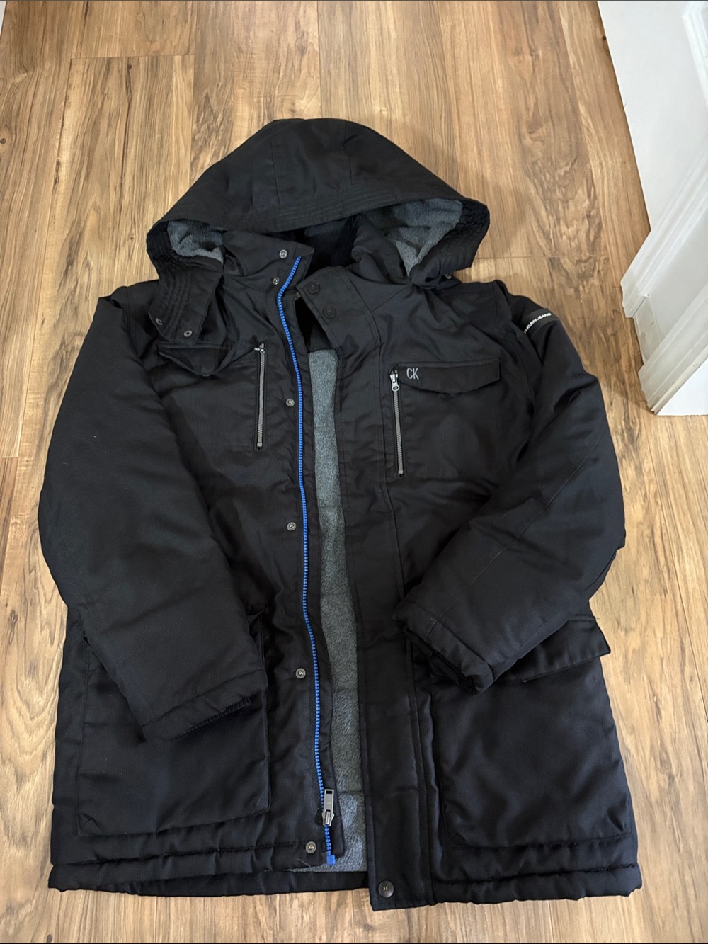 Calvin Klein Black Hooded Puffer Coat with Blue Zipper Trim